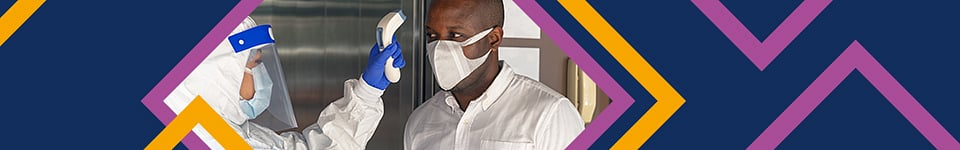 Person wearing PPE, checking temperature